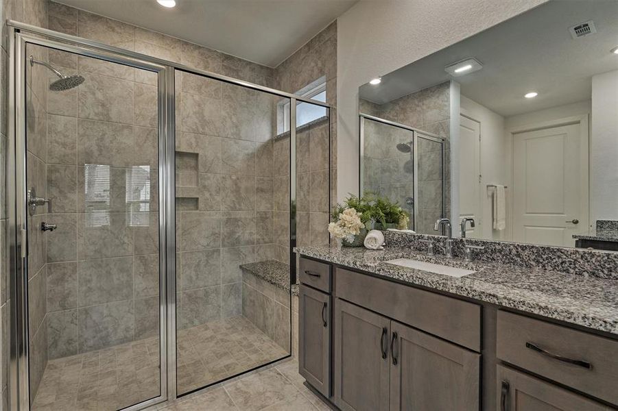 XL shower with a comfortable bench and large shower head!