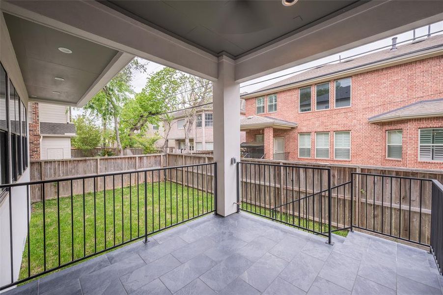 Off the breakfast nook lies a covered patio equipped with a gas line for a future kitchen installation.