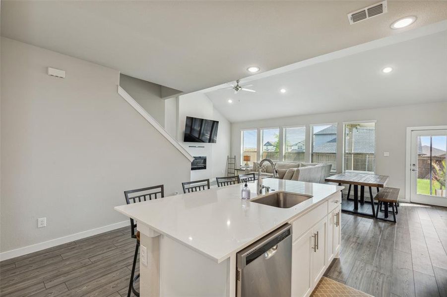 Open concept dine-in kitchen and living room with gorgeous natural light.