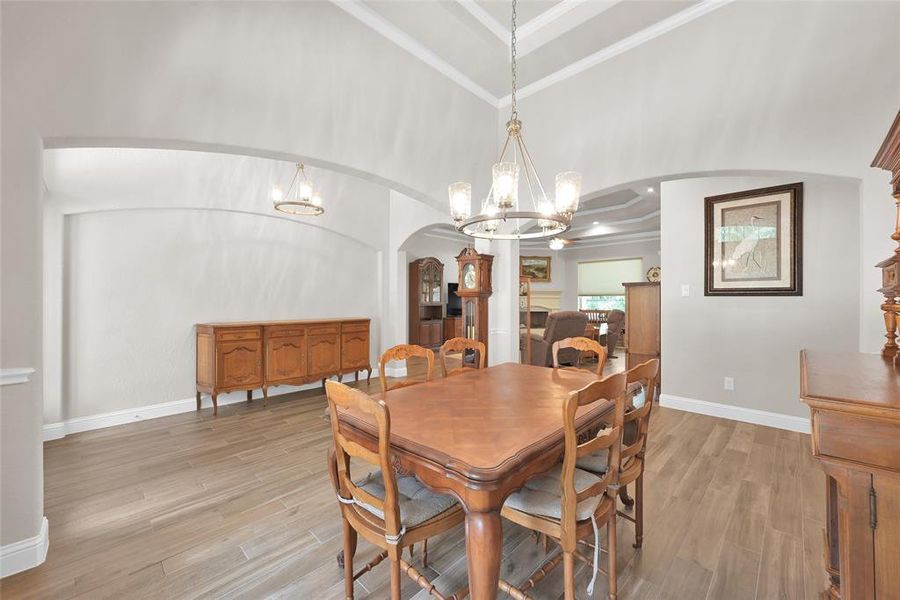 Large open formal dining space is located at the front of the home