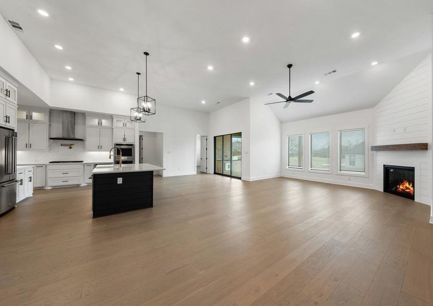 The open layout connects the kitchen with the breakfast area and family room.