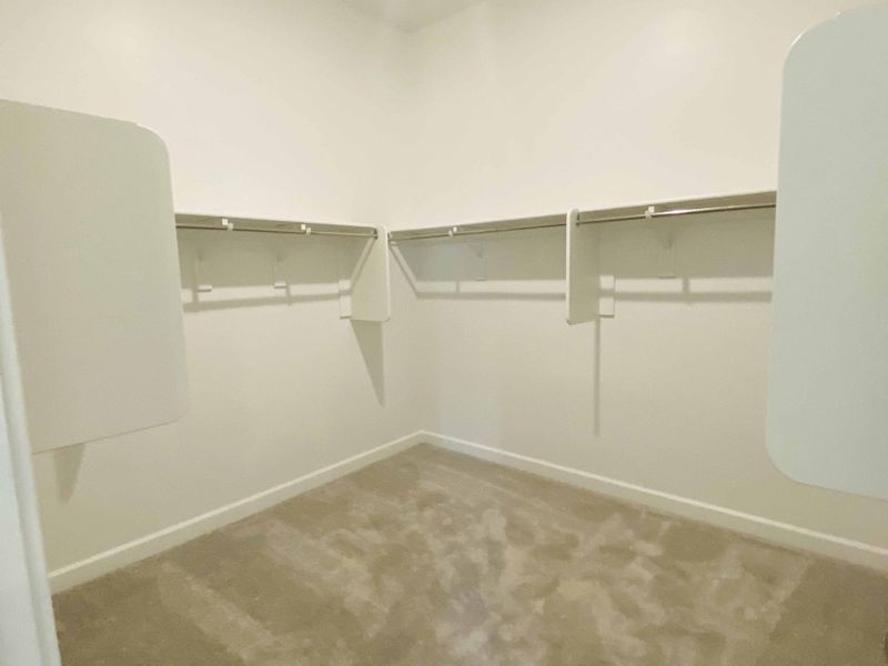 Opal plan primary walk-in closet. Options and finishes may vary by community.