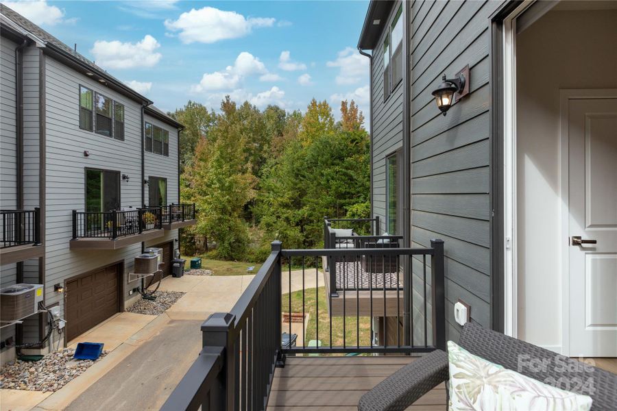 Wooded views from this corner-adjacent unit.