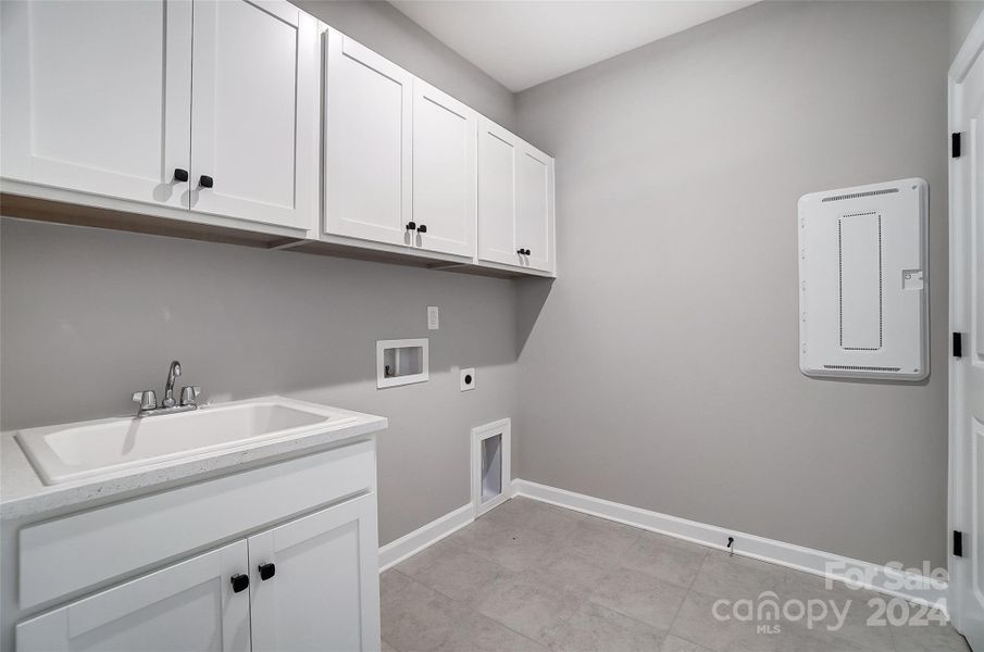 Laundry Room with Sink and Cabinets-Similar to Subject Property