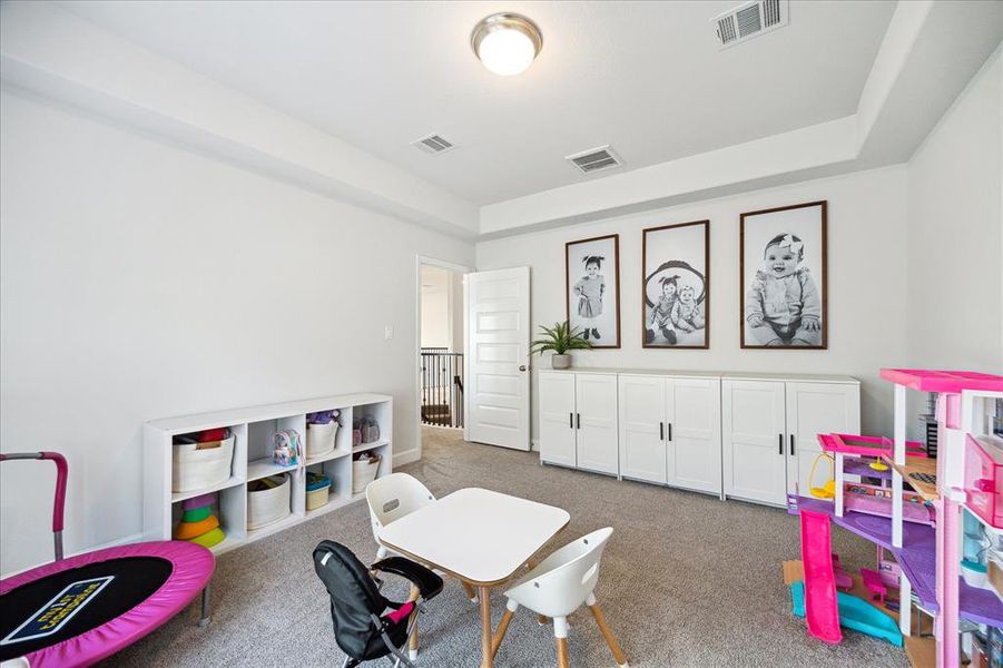 You're looking at a bright, spacious room currently used as a playroom. It's a versatile space that could easily be adapted to your needs.