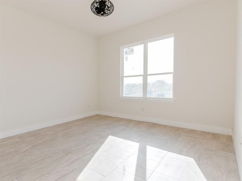 Spare room with light tile patterned floors