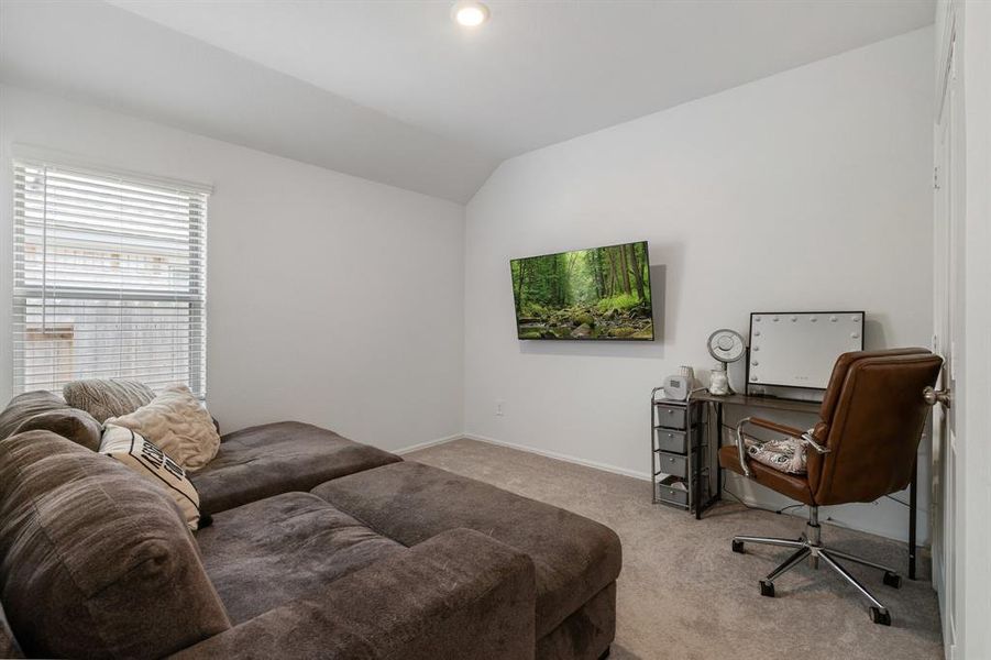 Guest room #2 is currently being used as a sitting area but is adjacent to the guest bathroom as well.