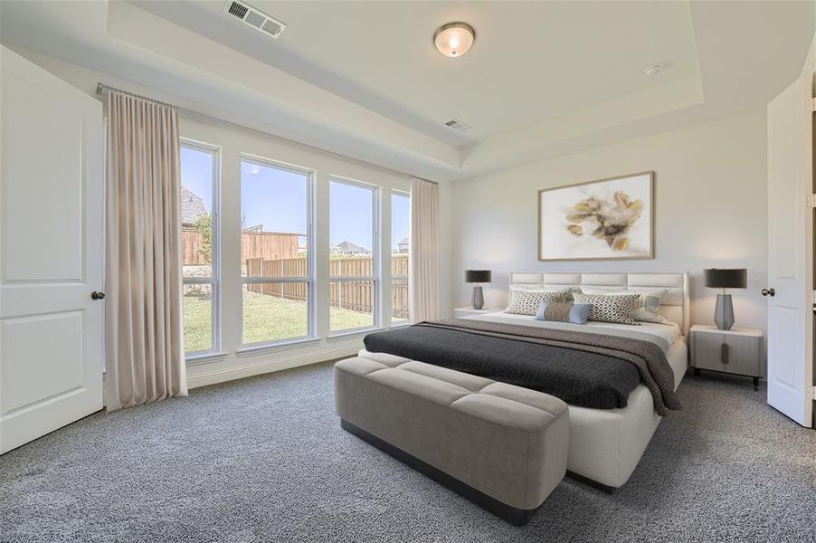 Virtually Staged Photo - Bedroom with carpet floors and a raised ceiling