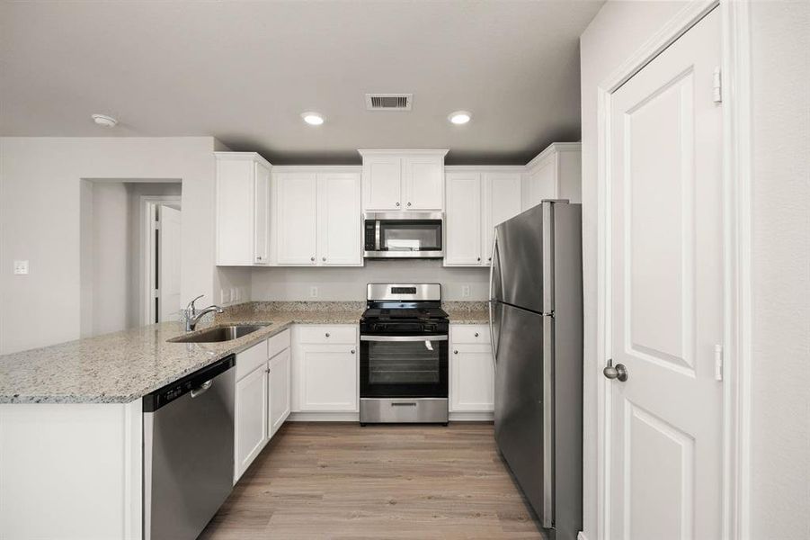 This chef ready kitchen is ready for entertaining.  Located next to the family room, this kitchen comes fully equipped and is sure to serve all your needs.