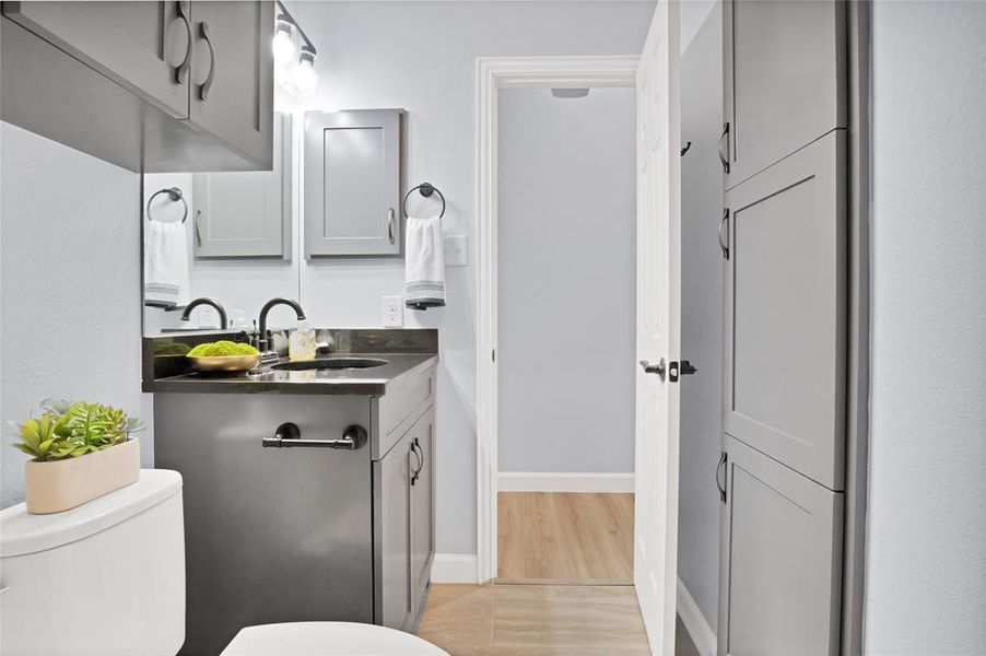 Spare bathroom with built-in storage cabinets and medicine cabinet offering an ample amount of storage space!