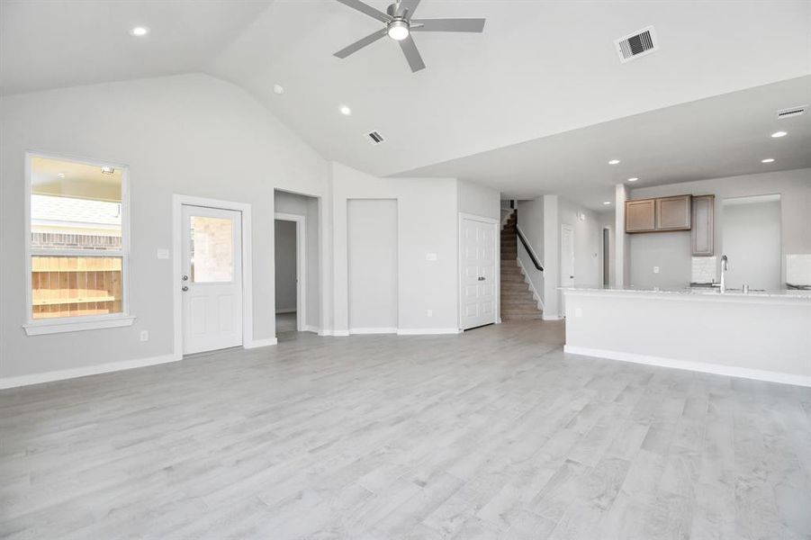 Take another glimpse into the heart of the home with this additional view of the family room—a sprawling space ready to accommodate all your gatherings. Photo shown is example of completed home with similar plan.