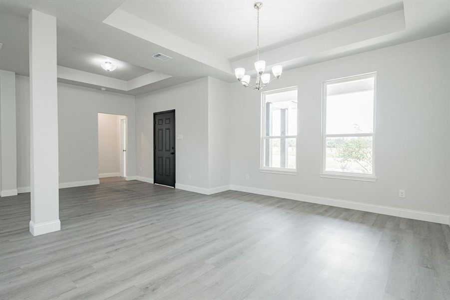 Spare room with light hardwood / wood-style flooring and ceiling fan