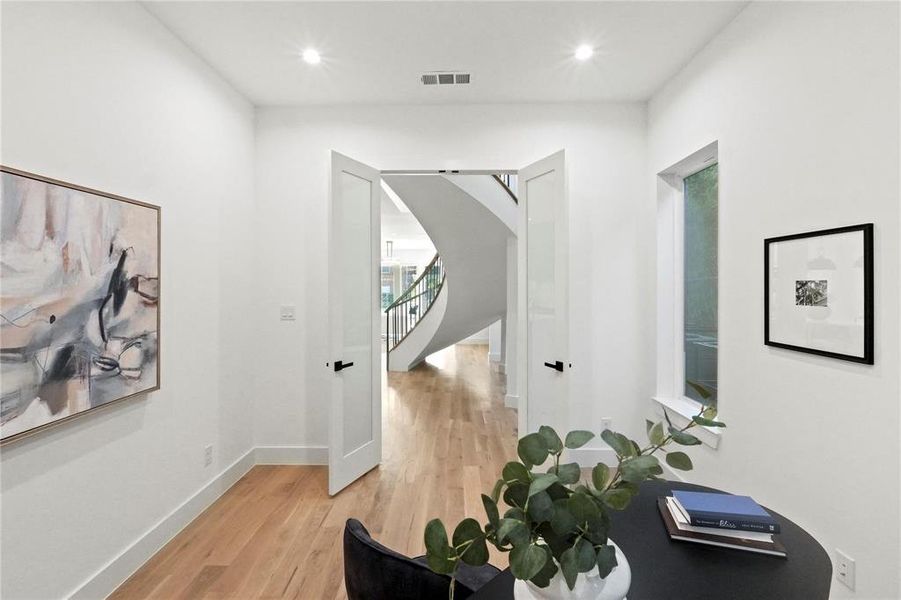 Entrance foyer with light wood-type flooring