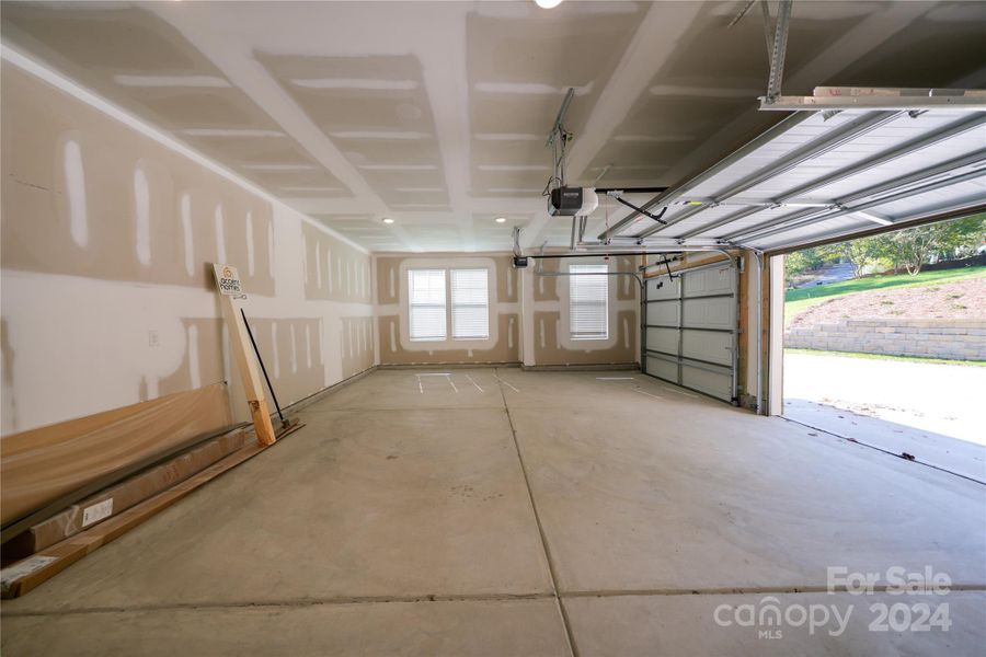 Spacious 2-car garage with storage space and natural light