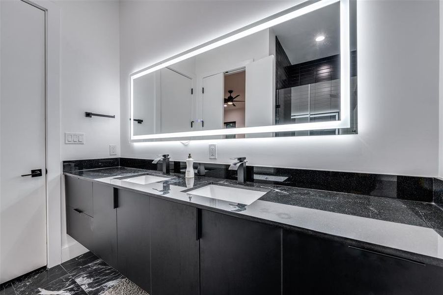 Bathroom with vanity and ceiling fan