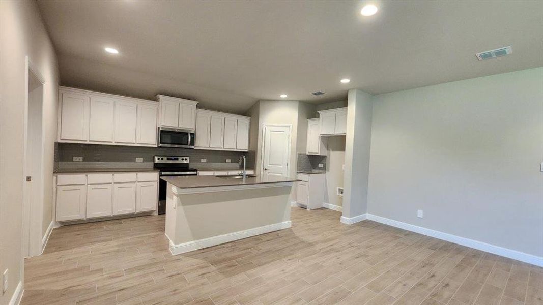 Kitchen - All Home and community information, including pricing, included features, terms, availability and amenities, are subject to change at any time without notice or obligation. All Drawings, pictures, photographs, video, square footages, floor plans, elevations, features, colors and sizes are approximate for illustration purposes only and will vary from the homes as built.