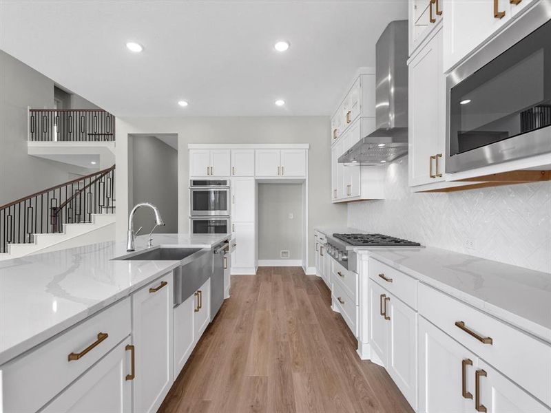 This kitchen is a masterpiece of design, blending beauty with functionality. Spacious and thoughtfully laid out, it features a large pantry and ample cabinet space, ensuring all your storage needs are met. With its refined finishes and smart layout, this kitchen is as practical as it is stunning—a perfect space for both everyday cooking and entertaining.