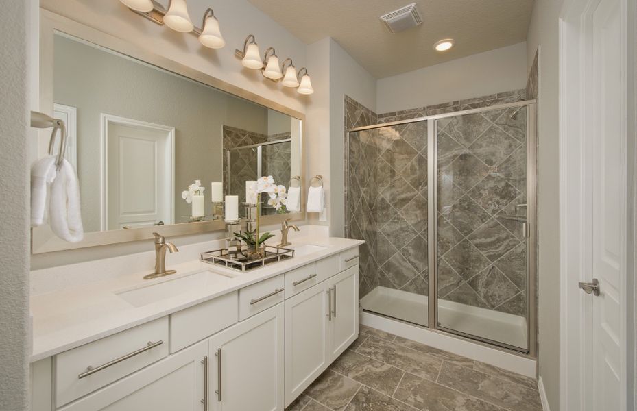 Owner's bath with double vanity and tile-surround