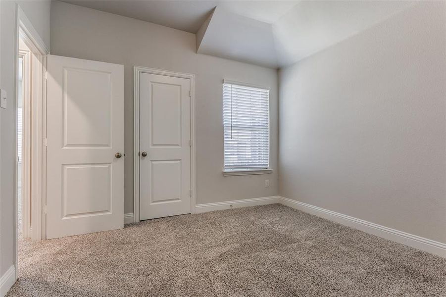 Unfurnished bedroom featuring carpet flooring
