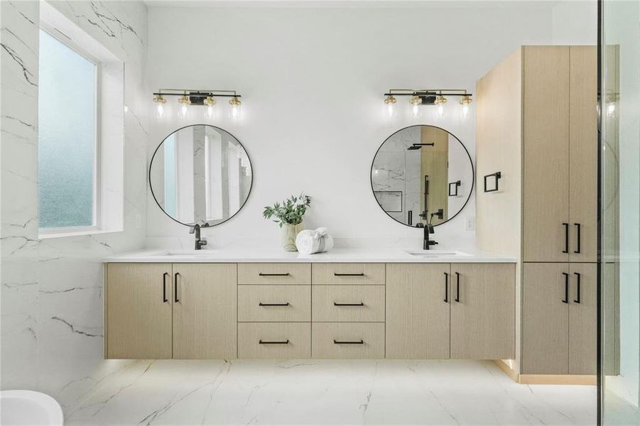 Bathroom with vanity and a shower with shower door