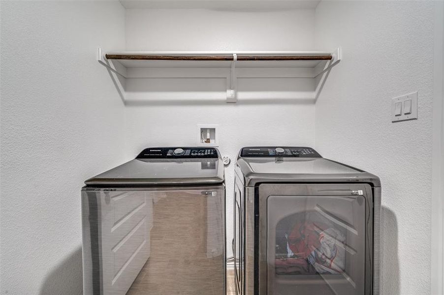 Washroom featuring independent washer and dryer