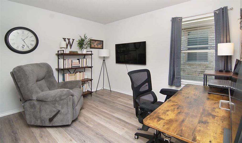 Office area featuring light hardwood / wood-style flooring