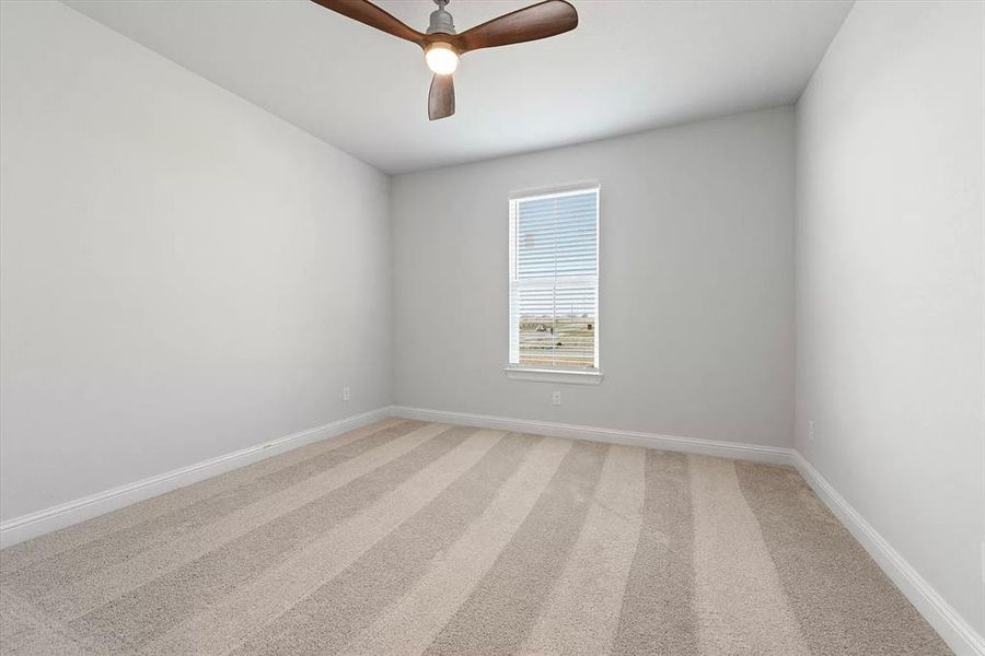 Bedroom with carpet and ceiling fan