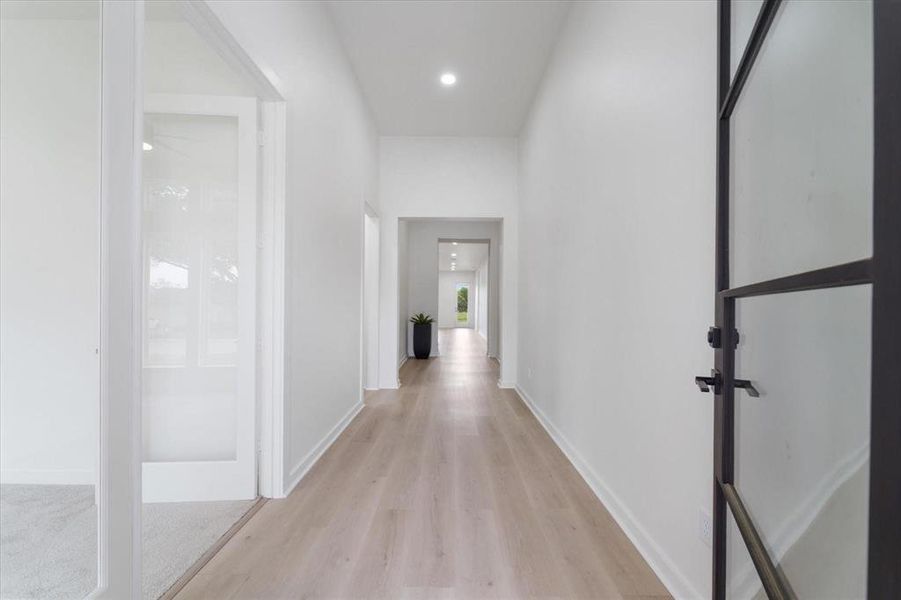 12 Foot ceilings in the entry hall. 8 foot modern front door.