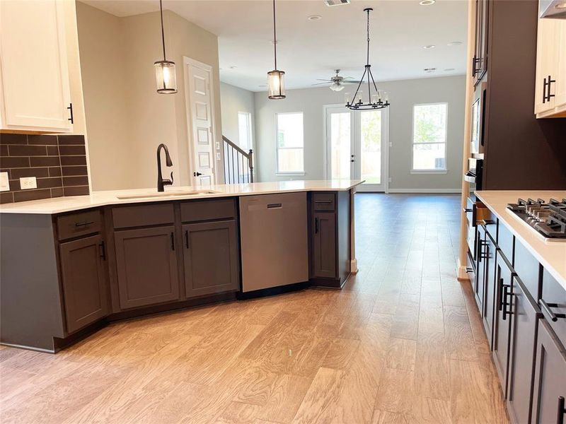 The kitchen in the ROClake home features a modern, open-concept design with a clean and sophisticated look.