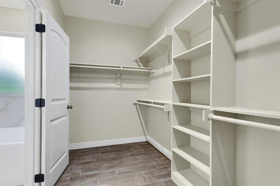 Spacious closet featuring Tile Plank flooring,