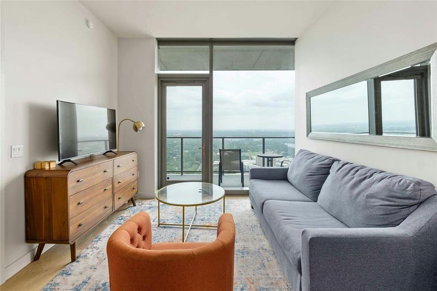 Open floor plan with floor to ceiling windows with vies of downtown and Lady Bird Lake