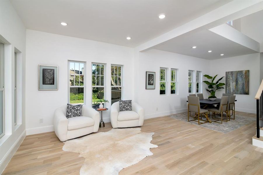 Living area with light hardwood / wood-style floors