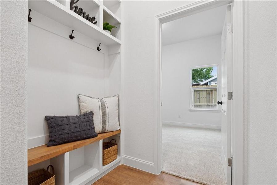 Mudroom featuring light wood-type flooring