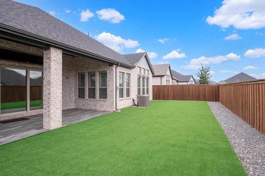 View of yard with a patio area and cooling unit