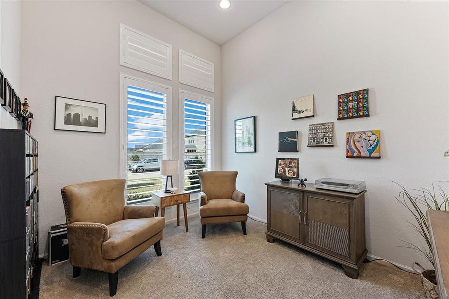 The entry foyer accesses the flex space/office with glass French doors (French doors currently removed but easily added back on request of buyers)