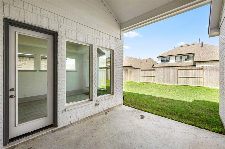 Covered back patio is ready for your housewarming and BBQ.