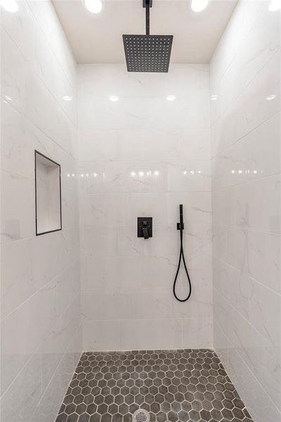 Bathroom featuring tiled shower