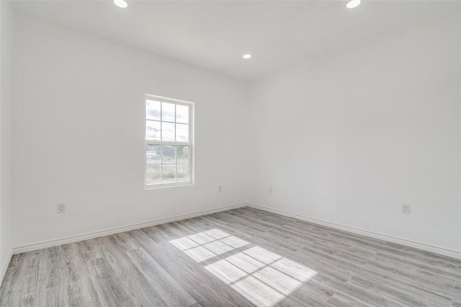 Empty room featuring light hardwood / wood-style floors