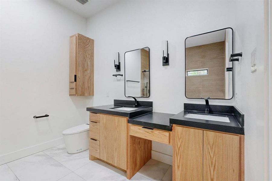 Bathroom with vanity and toilet