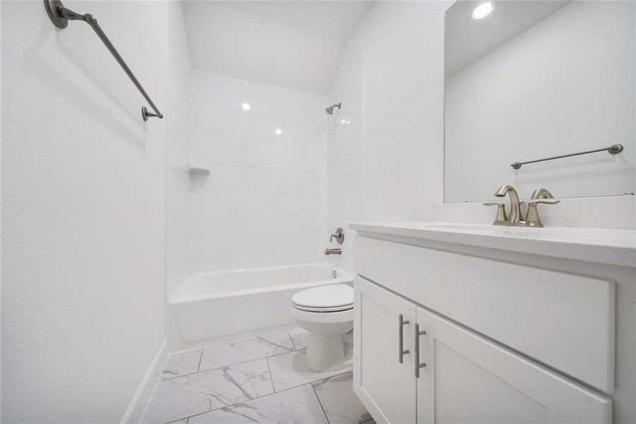 Secondary Bathroom is conveniently located between the two secondary bedrooms! (Sample photos of a completed Chesapeake floor plan. The image may feature alternative selections and/or upgrades.)