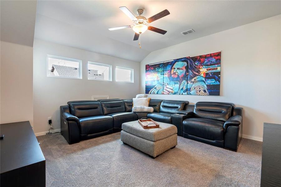 Oversized upstairs game room making this the perfect space for relaxing on a movie night.