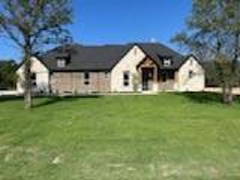 View of front of property with a front lawn