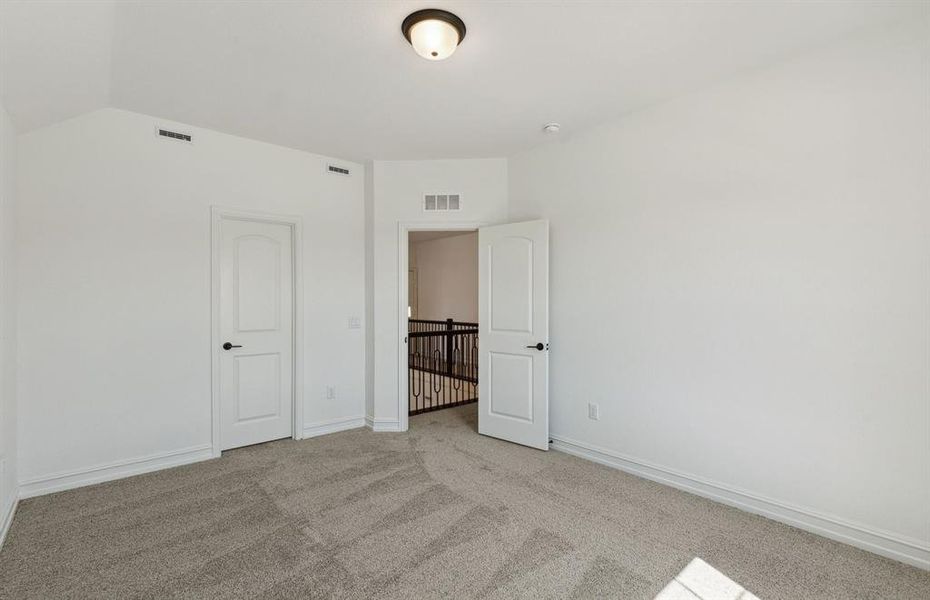 Secondary bedroom with ample closer space *real home pictured