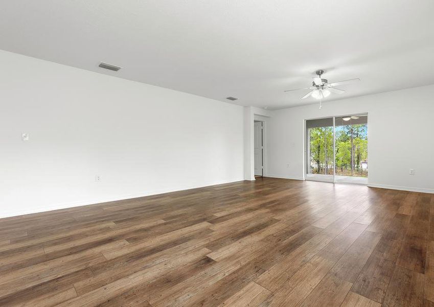 The family room is spacious with a sliding glass door to the back patio