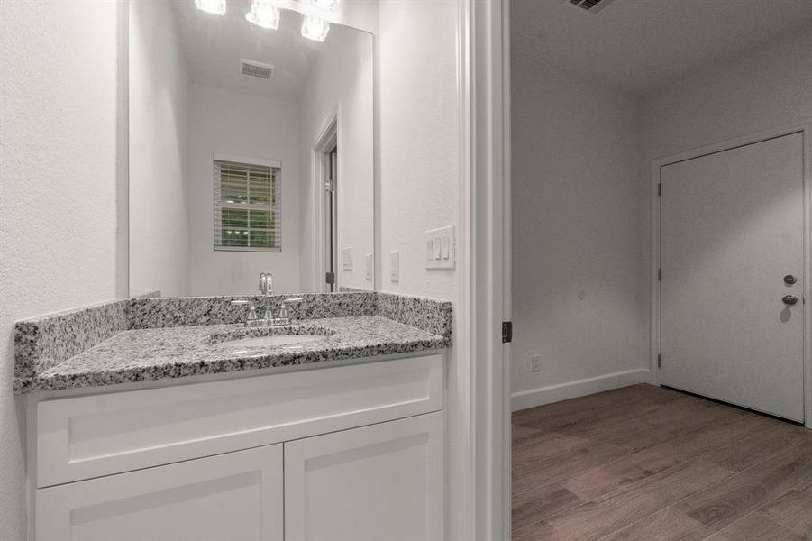 HALF BATH IN MUD ROOM