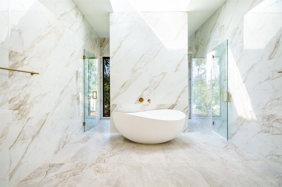 Bathroom with independent shower and bath and tile walls