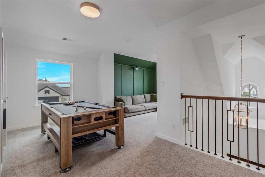 Recreation room with carpet, vaulted ceiling, and billiards