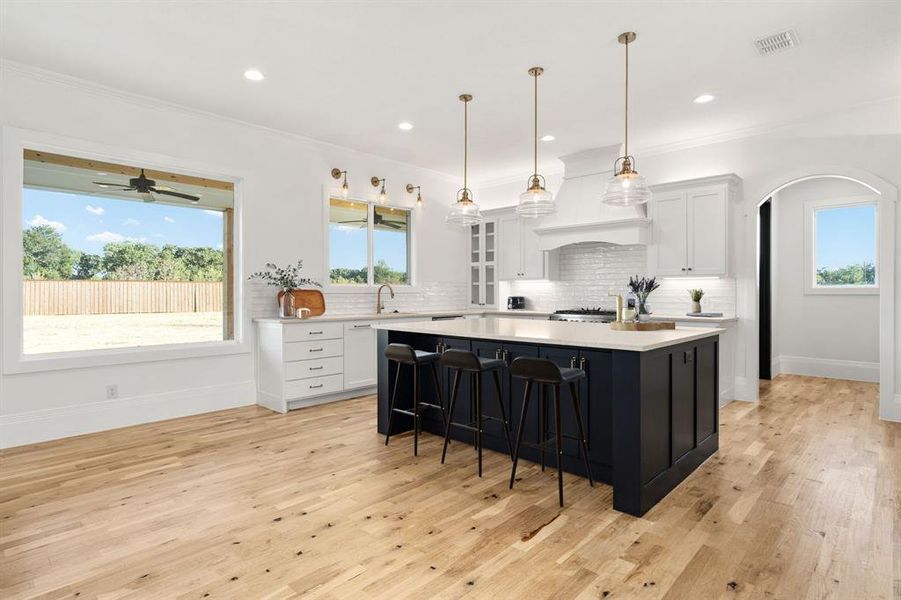 Breakfast bar for relaxed dining; just beyond is a built-in desk area and the HUGE pantry!