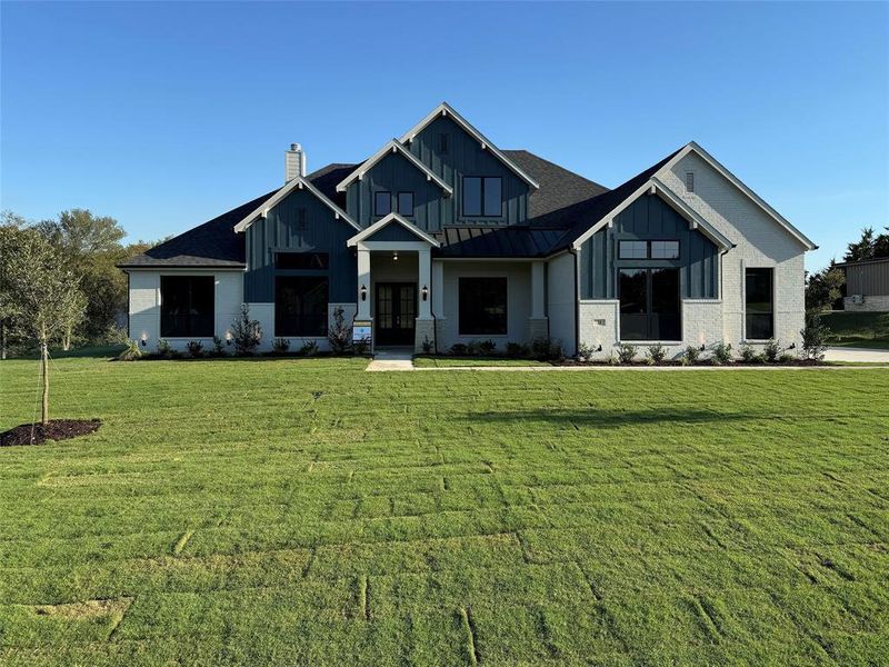 View of front of house with a front yard