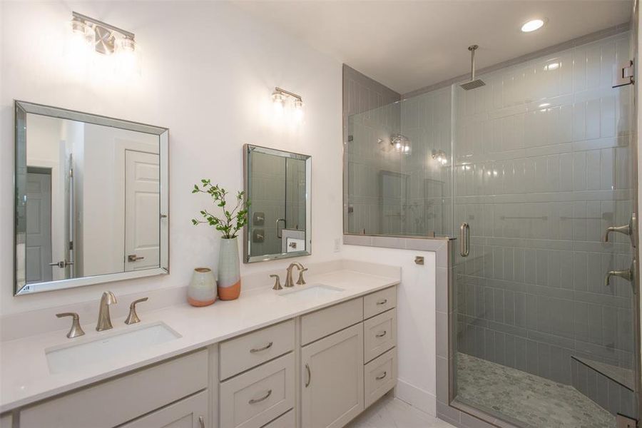 Bathroom featuring vanity and walk in shower